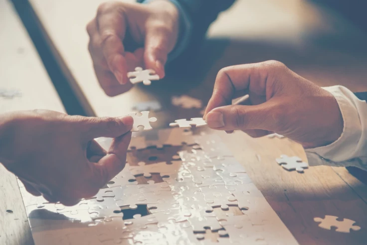 a group completing a jigsaw